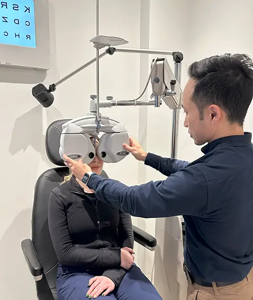Optometrist eye exam in Newmarket using the phoropter